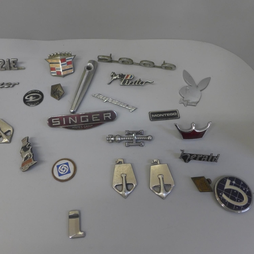 701 - A collection of car badges