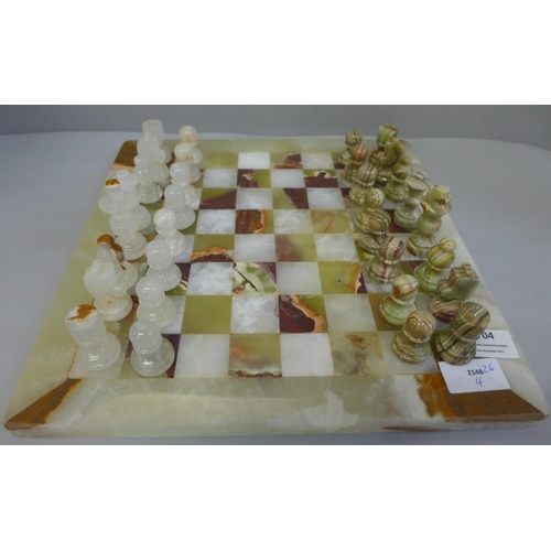 704 - A marble chessboard, with pieces