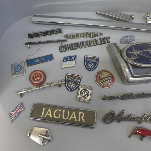 705 - A collection of car badges