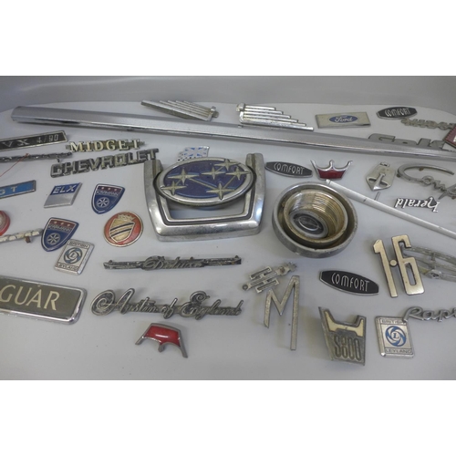 705 - A collection of car badges