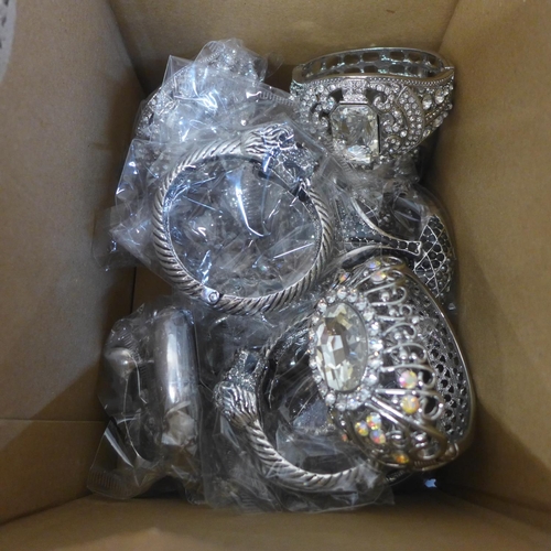 720 - Two boxes of thirty-six diamante bangles, unused shop stock