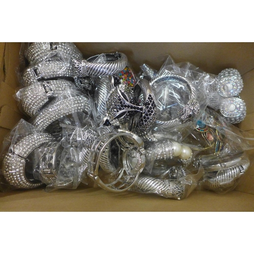 720 - Two boxes of thirty-six diamante bangles, unused shop stock