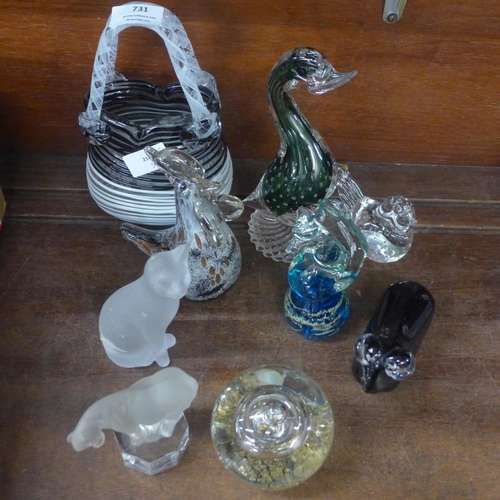 731 - A collection of glass paperweights and a glass basket including M'dina (9)