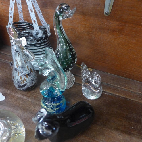 731 - A collection of glass paperweights and a glass basket including M'dina (9)