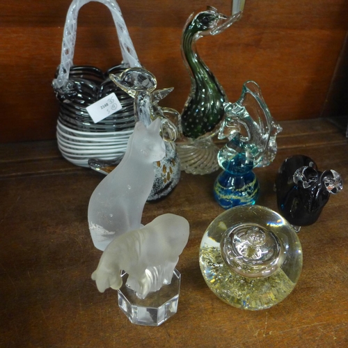 731 - A collection of glass paperweights and a glass basket including M'dina (9)