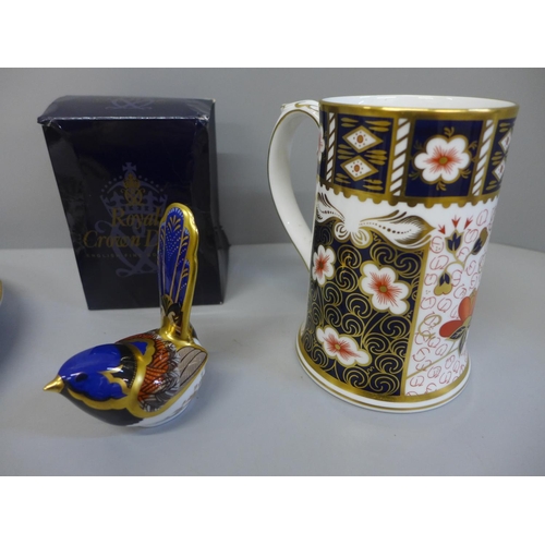 732 - A Royal Crown Derby mug, a Fairy Wren paperweight with gold stopper, boxed and a Crown Derby plate