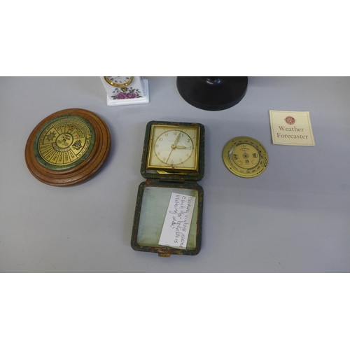 752 - A small globe, clock, travel clock, a 40 year calendar and a pocket brass barometer guide/forecaster