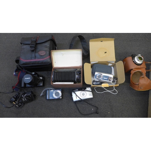 760 - A Canon EOS 500 camera, an Agfa camera, a Vorsatz attachment, a Canon Powershot camera, a Panasonic ... 