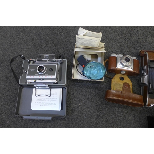 768 - A collection of vintage cameras, including Polaroid, Minolta and Agfa