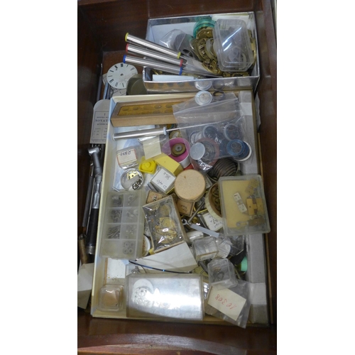 776 - A box of mixed watch parts, batteries, dials, etc.