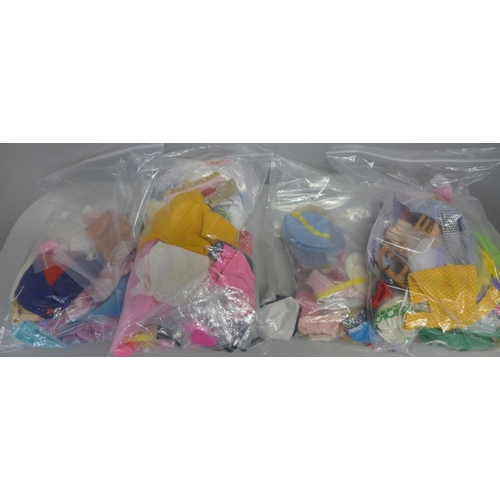 805 - Four bags of fashion doll clothes, etc