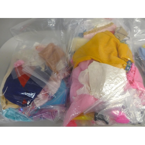 805 - Four bags of fashion doll clothes, etc