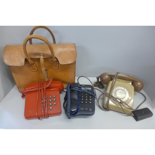 822 - Three telephones and a leather bag