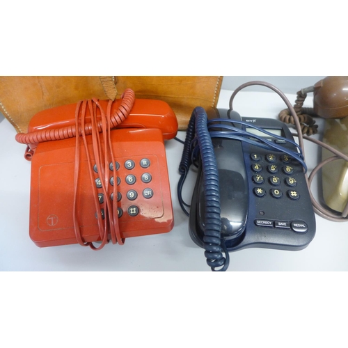 822 - Three telephones and a leather bag