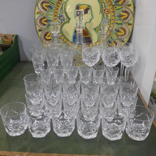 823 - A suite of Waterford crystal; six of champagne, hock, sherry, whisky and two sets of tumblers, plus ... 