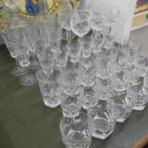 823 - A suite of Waterford crystal; six of champagne, hock, sherry, whisky and two sets of tumblers, plus ... 