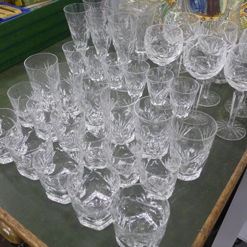 823 - A suite of Waterford crystal; six of champagne, hock, sherry, whisky and two sets of tumblers, plus ... 