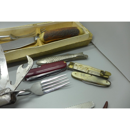 889 - A collection of knives, penknives and a carving set