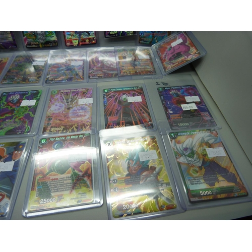 901 - Various holographic Dragonball Z trading cards in protective sleeves