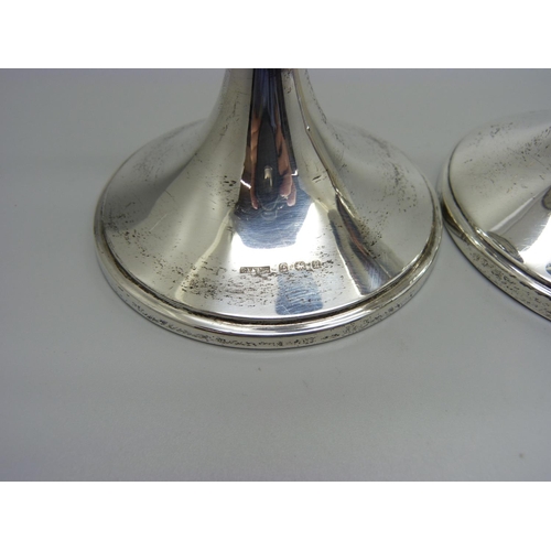 914 - A pair of silver candlesticks, Birmingham 1932/6, weighted bases