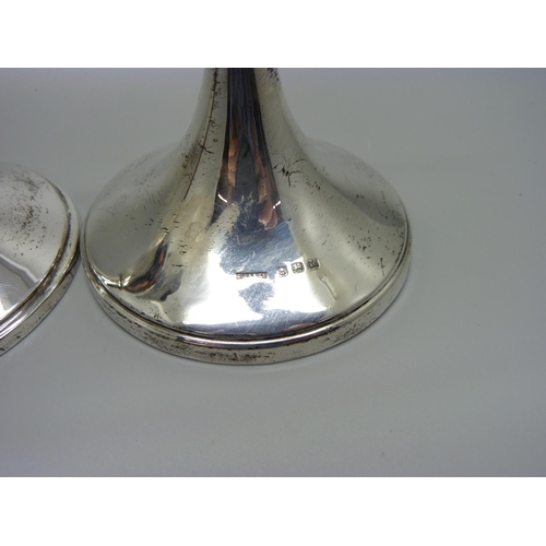 914 - A pair of silver candlesticks, Birmingham 1932/6, weighted bases