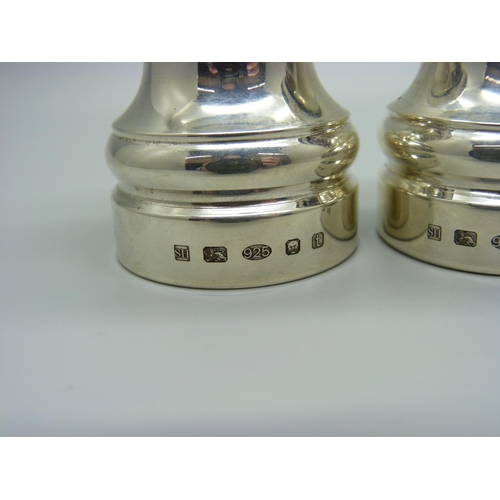 916 - A pair of silver pepper grinders, gross weight 259g