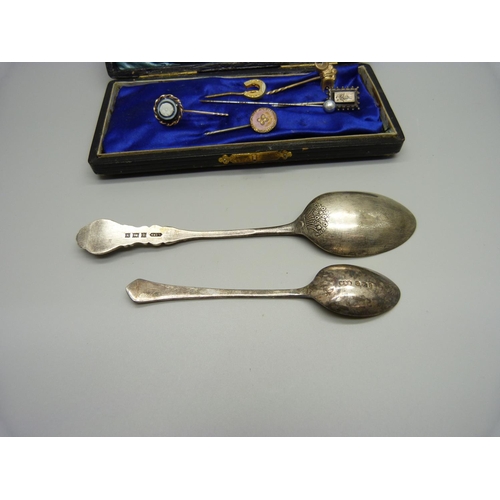 935 - Two silver spoons, a silver pin and five other pins, spoons 31g