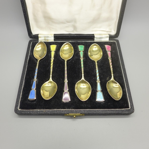 942 - A set of six silver and enamel spoons by Walker & Hall, cased, 61g