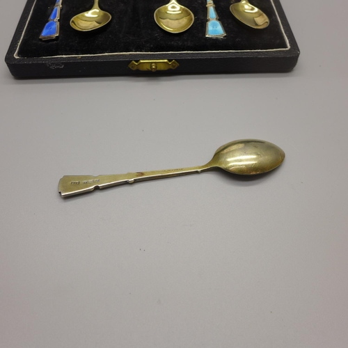 942 - A set of six silver and enamel spoons by Walker & Hall, cased, 61g