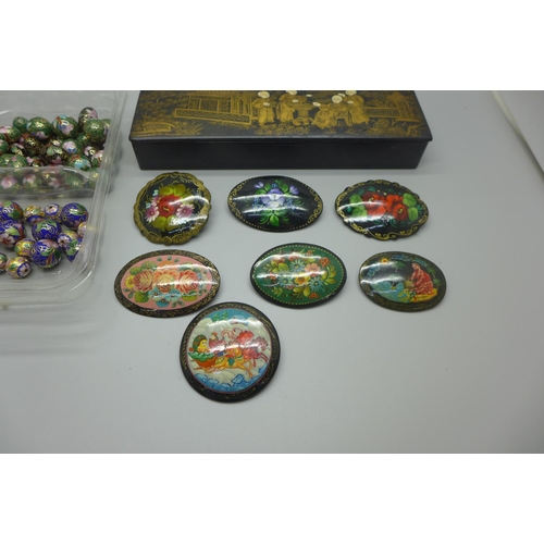 948 - A collection of cloisonne beads, hand painted brooches and a Japanese papier mache box