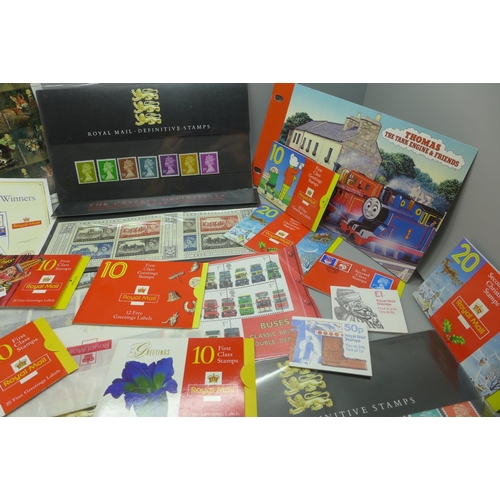 967 - Ten Royal Mail stamp booklets, three PHQ packs and a folder of mint stamps including first and secon... 