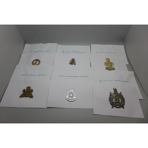 995 - A collection of twenty-four Regimental cap badges, catalogued, in envelopes