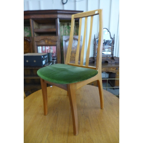 10 - A Sutcliffe of Todmorden teak extending dining table and four chairs