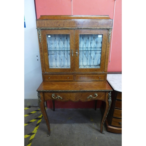 100 - A French Louis XV style inlaid walnut and gilt metal mounted side cabinet