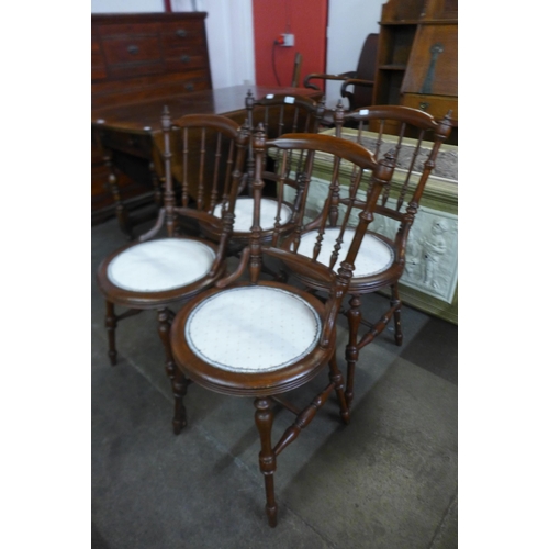 104 - A set of four Victorian beech penny seat kitchen chairs