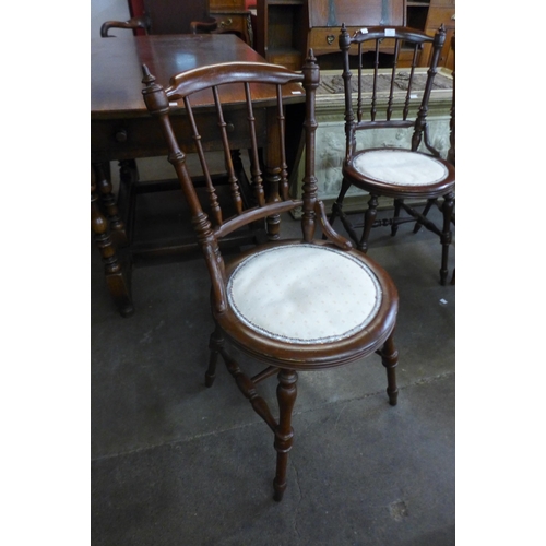 104 - A set of four Victorian beech penny seat kitchen chairs