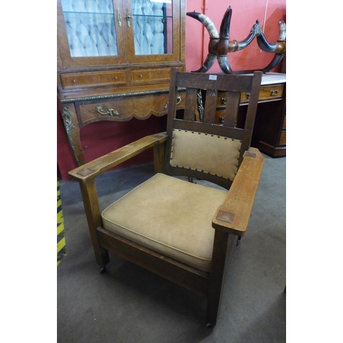 107 - An American Arts and Crafts oak armchair, manner of Gustav Stickley