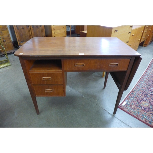 11 - A Jentique teak metamorphic drop leaf desk