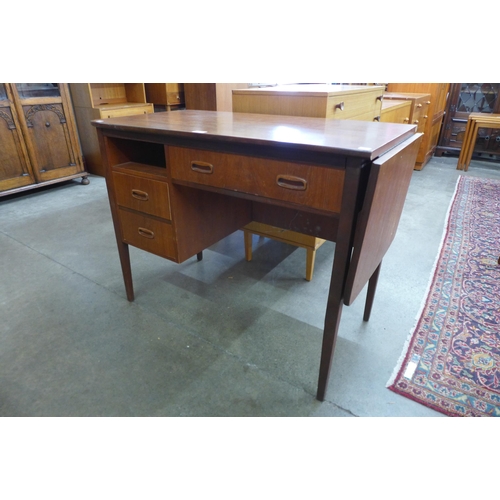 11 - A Jentique teak metamorphic drop leaf desk