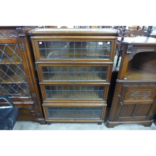 110 - An early 20th Century Globe Wernicke oak four tier sectional stacking bookcase