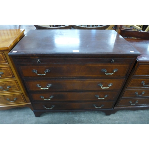 120 - An inlaid mahogany chest of drawers, with brushing slide