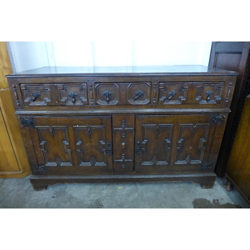 137 - A William III oak geometric moulded dresser