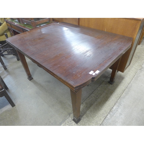 169 - A mahogany draw-leaf dining table