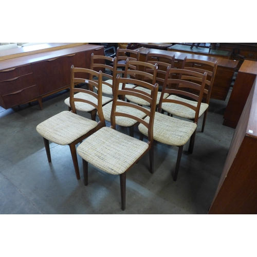 25 - A set of eight teak dining chairs