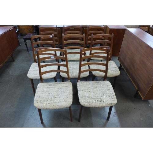 25 - A set of eight teak dining chairs