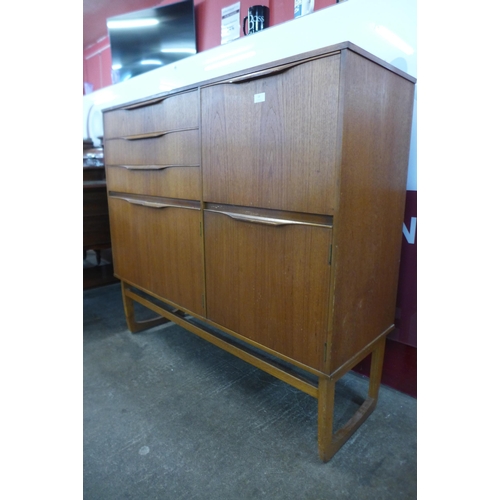 28 - A teak side cabinet