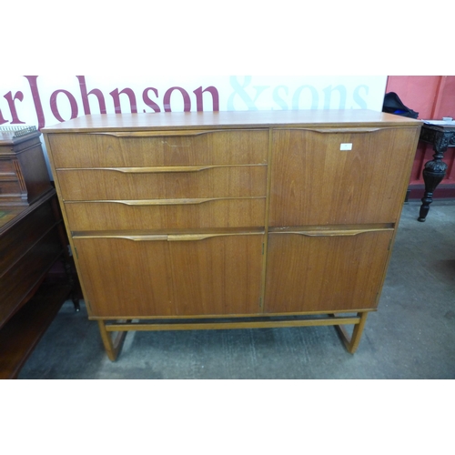 28 - A teak side cabinet