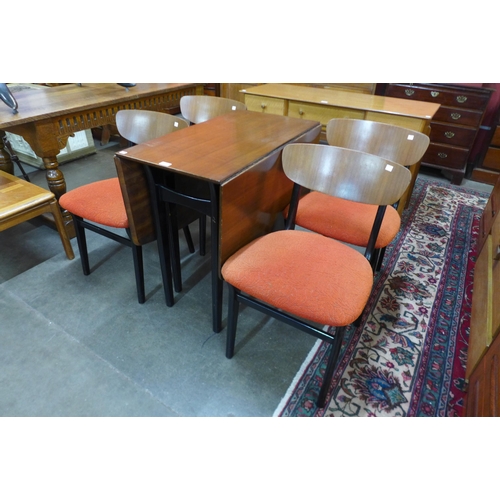 36 - A Portwood Ltd. tola wood and black drop leaf table and four chairs