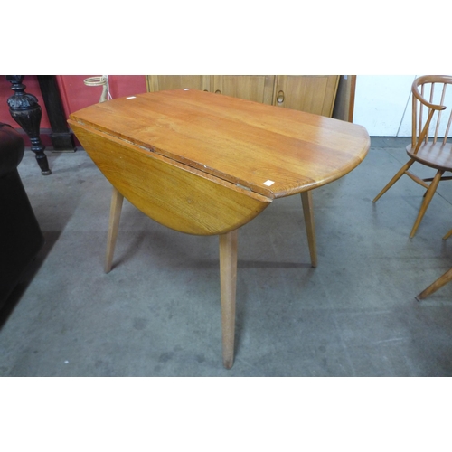 4 - An Ercol Blonde elm and beech Windsor drop leaf table