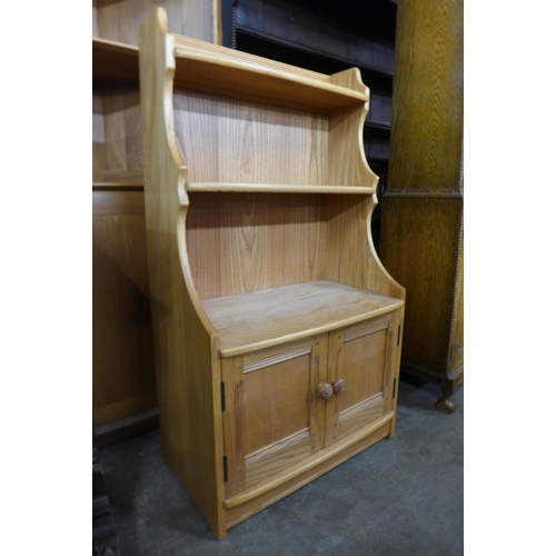 46 - An Ercol Blonde ash open bookcase